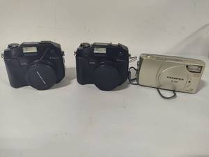 lot 155 image: Two Olympus C-5060 Cameras & One Olympus D-380 Camera