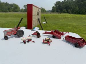 lot 84 image: RED METAL TRACTOR AND IMPLEMENTS.