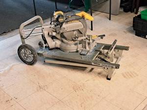 lot 2 image: DeWalt 12 Sliding Compound Miter Saw DW708 with Ridgid Miter Saw Utility Vehicle MS-UV