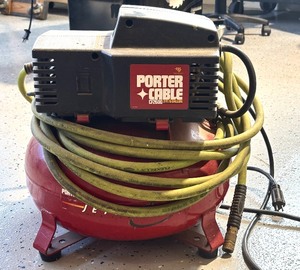 lot 71 image: Porter Cable Electric Air Compressor with Hose