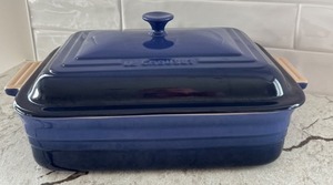 lot 28 image: Le Creuset 4.5 Qt Blue Stoneware Covered Baker