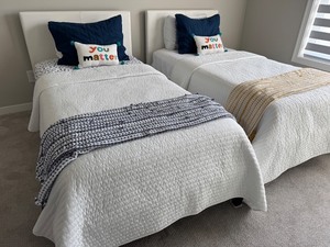 lot 151 image: Pair of Twin Bed Frames with Mattresses and Linens