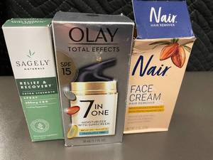 lot 8 image: Lot of 3 Personal Care Products Sagely Naturals Spray, Olay 7-in-1 Moisturizer, Nair Face Cream