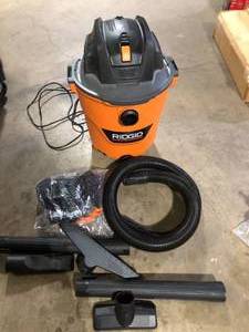 lot 41 image: RIDGID 12 Gallon 5.0 Peak HP NXT Shop Vacuum Wet Dry Vac with General Debris Filter, Locking Hose and Accessory Attachments Used Good   Customer Returns See Pictures