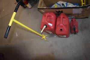 lot 77 image: Gas Cans and weed puller