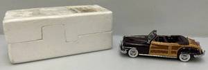 lot 43 image: Vintage 124 Scale Danbury Mint 1948 Chrysler Town & Country (New In Styrofoam Packing)