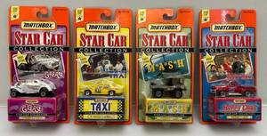 lot 48 image: Vintage Matchbox STAR CAR Collection Miniature Die Cast Cars Including Grease, Happy Days, Mash & Taxi (NIB)