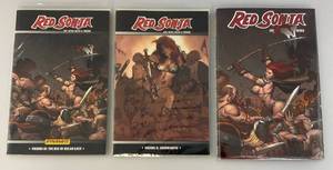 lot 103 image: Misc. RED SONJA Graphic Novels 1 Hard Cover 2 Paperback (Bagged And Carded)
