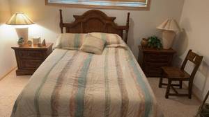 lot 70 image: Vintage Oak Bedroom Set with Bed, Nightstands, and Armoire