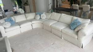 lot 104 image: Elegant White Sectional Sofa with Decorative Pillows