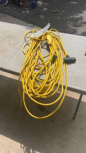 lot 257 image: Heavy-Duty Yellow Extension Cord with Multiple Outlets