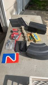 lot 324 image: Complete Slot Car Racing Track Set with Track Pieces, Accessories, and Power Pack