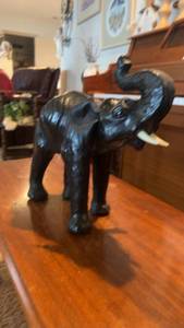lot 384 image: Hand-Carved Wooden Elephant Statue with Ivory Tusks