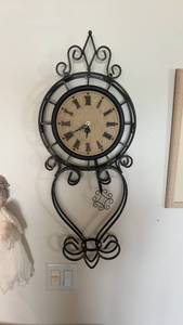 lot 400 image: Elegant Wall-Mounted Wrought Iron Clock with Roman Numerals