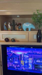 lot 437 image: Southwestern Decor Collection with Painted Vases, Figurines, and Rug
