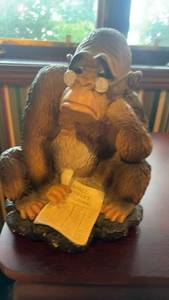 lot 497 image: Humorous Monkey Figurine Reading Wall Street Journal