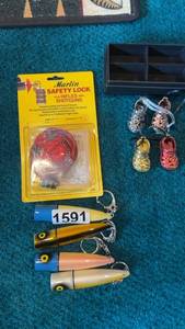 lot 591 image: Collection of 3 Lures and Marlin Gun Safety Lock with Basket Charms