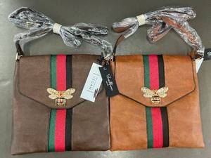 lot 23 image: Set of 2 Stylish Vegan Leather Crossbody Bags with Bee Emblem