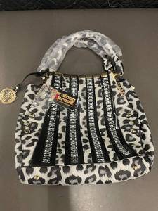 lot 24 image: Fashionable Leopard Print Handbag with Gold Accents