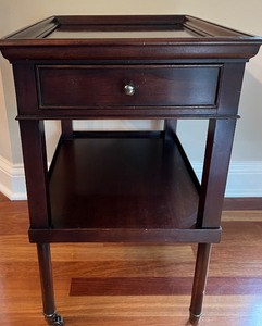 lot 11 image: Milling Road by Baker Furniture Wooden Side Table with Casters
