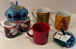 lot 87 image: Set of 6 Mugs with Disney Stitch Mug, Letter Mugs, and Rugby Themed Mugs