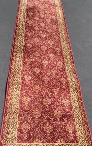 lot 139 image: Elegant Red Runner Rug with Border Pattern and pad