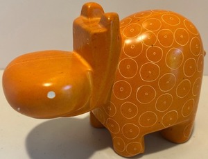 lot 99 image: Orange Ceramic Hippo Figurine with Circle Pattern