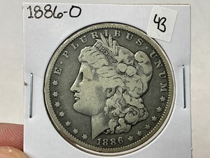 lot 43 image: 1886-O Morgan Silver Dollar