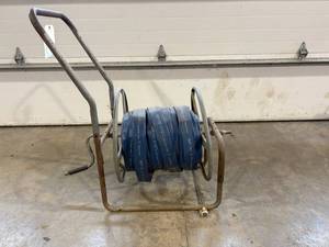 lot 3 image: Discharge Hose on Reel Stand