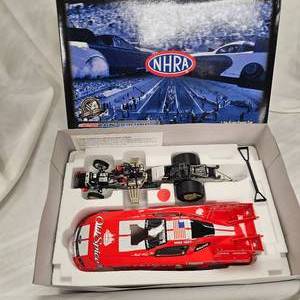lot 20 image: NHRA 124 Mike Neff Old Spice Funny Car by Action Racing