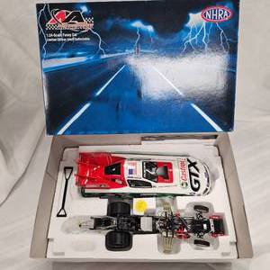 lot 32 image: NHRA 124 John Force Castrol Funny Car by Action Racing