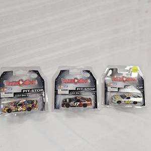 lot 120 image: 164 Team Caliber #17 Carthartt, #6 Ameriquest, #17 Penzoil(3)