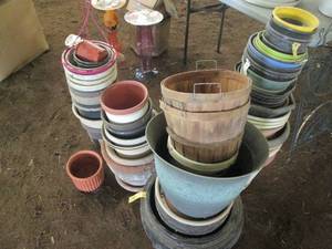 lot 72 image: Huge variety of planters and basket...