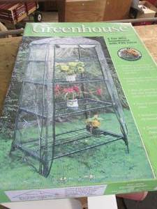 lot 303 image: New in Box 4-Tier Mini Greenhouse w...