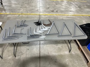 lot 269 image: TABLE FULL OF SHELF BRACKETS