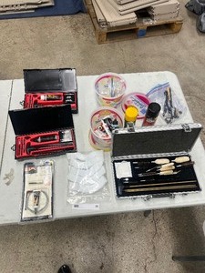 lot 95 image: TABLE FULL OF GUN CLEANING KIT AND ACCESSORIES