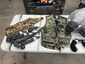 lot 100 image: 9 CANADIAN DECOYS, 13 SILOETTES , VEST, & 2 AMMO BELTS