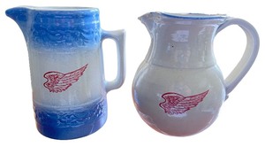 lot 77 image: Set of 2 Red Wing Stoneware Pitchers with Winged Logo