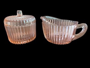 lot 104 image: Vintage Pink Depression Glass Sugar Bowl and Creamer Set