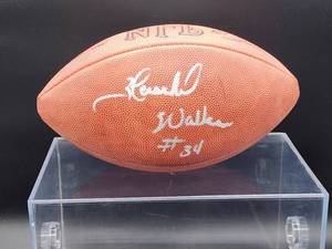 lot 80 image: Autographed NFL Football by Dallas Cowboys Running Back Great Hershel Walker No COA