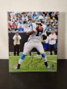 lot 105 image: Autographed Photo by Carolina Panthers Great Quarterback Cam Newton with COA