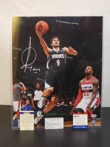 lot 136 image: Autographed Photo by Minnesota Timberwolves Great Ricky Rubio with COA