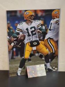 lot 114 image: Autographed Photo by Future HOF Green Bay Packers Great Quarterback Aaron Rogers with COA