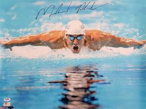 lot 38 image: Autographed Photo by Olympic Gold Medal Swimmer Michael Phelps with COA