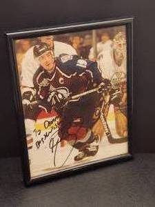 lot 143 image: Autographed Photo by Colorado Avalanche HOF Great Joe Sakic No COA