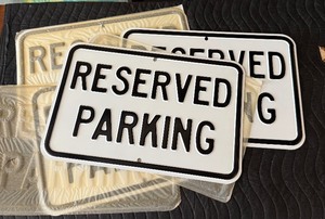 lot 81 image: 4 New Old Stock Embossed Steel RESERVED PARKING Signs
