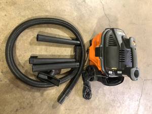 lot 10 image: RIDGID 4 Gal. 5.0 Peak HP Portable Shop Vacuum WD4070 Wet Dry Vac with Fine Dust Filter, Locking Hose and Attachments   Customer Returns See Pictures