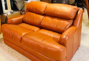 lot 13 image: Faux Leather Loveseat