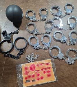 lot 58 image: Lot of Costume Accessories Ball & Chain, Hand Cuffs, Keys, Stick-On Scabs