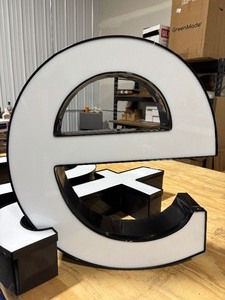 lot 28 image: White Front Lit Channel Letter E Illuminated Sinage